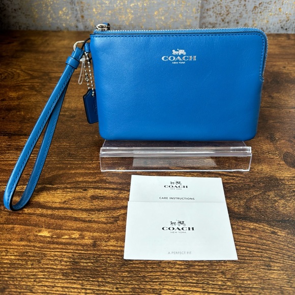 Coach Handbags - Coach Blue Leather Wristlet Clutch